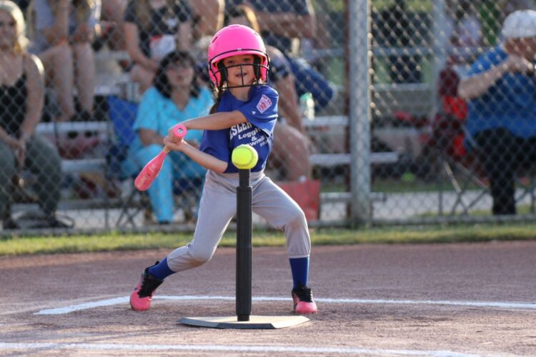 girl playing tball